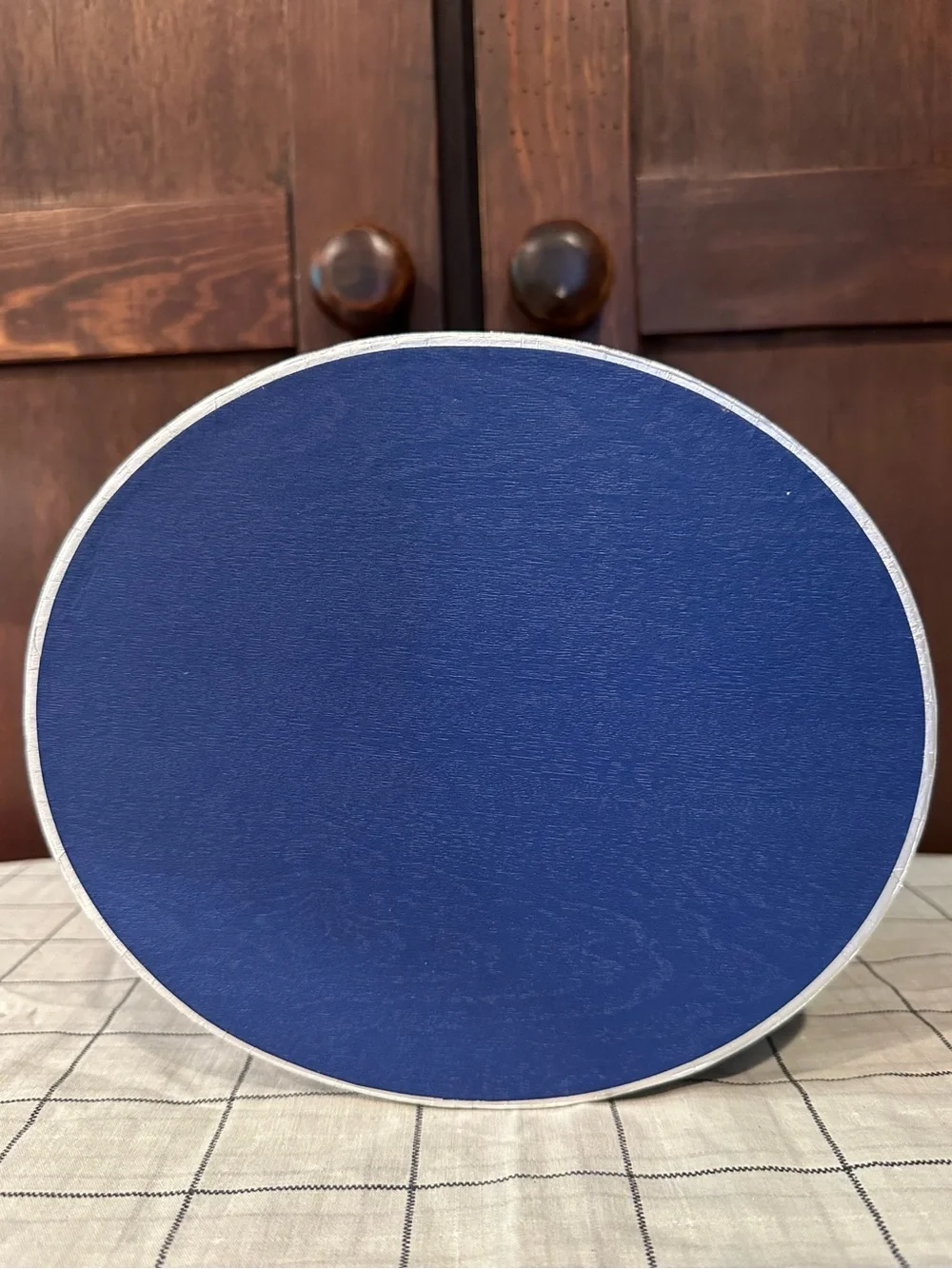 Heavy cardboard • oval lidded box • in new condition • blue w/silver trim